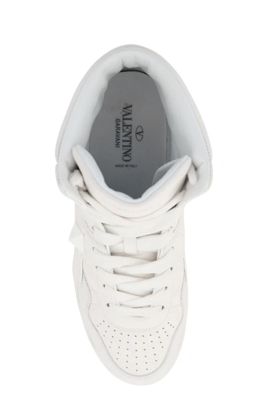 Shop Valentino Garavani One Stud Hi-top Sneakers In White