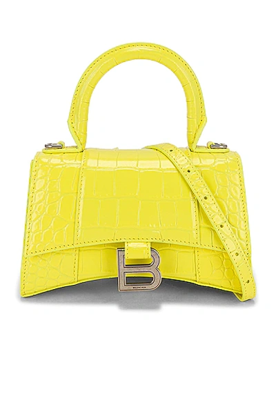 Shop Balenciaga Xs Hourglass Top Handle Bag In Light Yellow