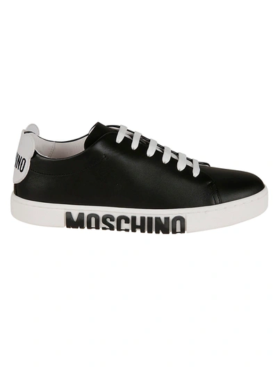 Shop Moschino Embossed Logo Sole Sneakers In Black