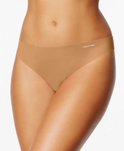 Shop Calvin Klein Women's Invisibles Thong Underwear D3428 In Bronzed (nude 3)