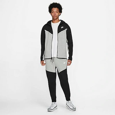 Shop Nike Tech Fleece Taped Jogger Pants In Black/dark Grey Heather/white