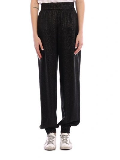 Shop Saint Laurent Lamè Knitted Trousers In Black