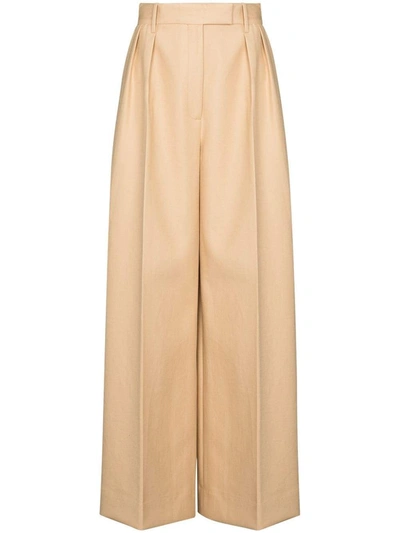 Shop Khaite Trousers Beige