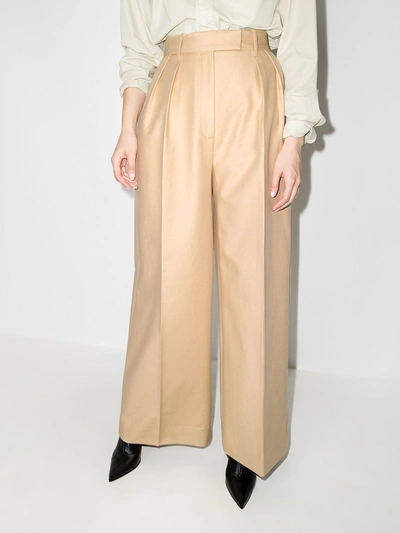 Shop Khaite Trousers Beige