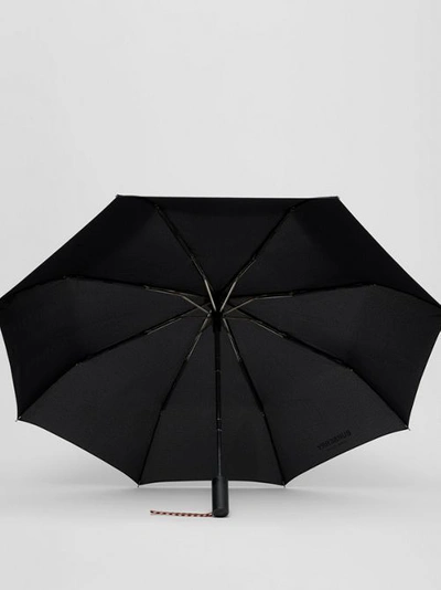 Shop Burberry Logo Print Folding Umbrella In Black