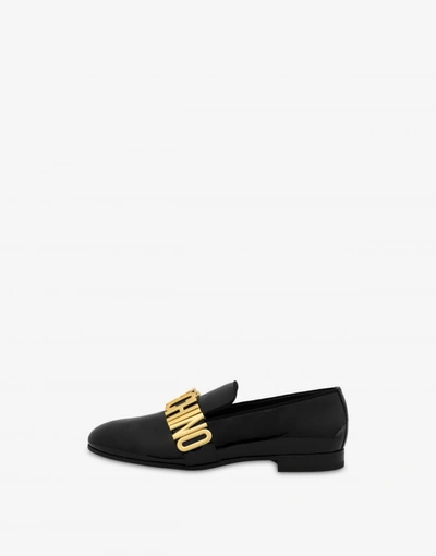 Shop Moschino Metal Lettering Patent Leather Loafers In Black
