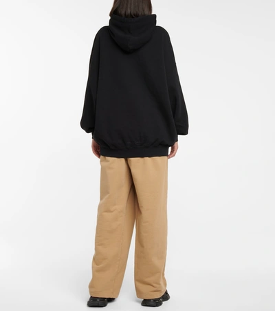 Shop Balenciaga Printed Cotton Jersey Hoodie In Black