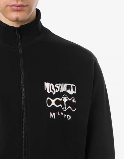 Shop Moschino Warped Glitch Logo Zipped Sweatshirt In Black