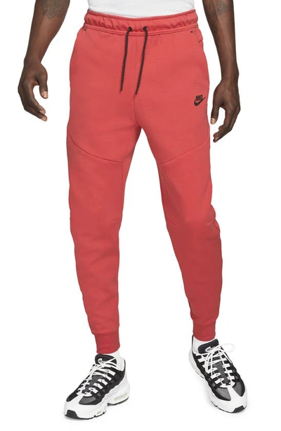 Shop Nike Tech Fleece Jogger Sweatpants In Lobster/ Black