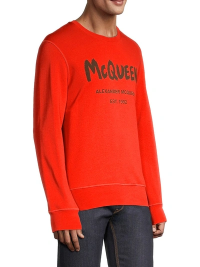 Shop Alexander Mcqueen Graffiti Print Logo Sweatshirt In Orange Khaki