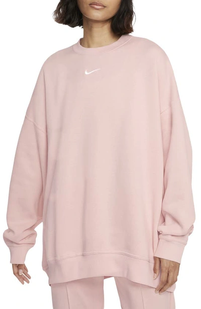 Shop Nike Sportswear Collection Essentials Oversize Fleece Crew Sweatshirt In Pale Coral/ White