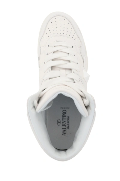 Shop Valentino One Stud Hi-top Sneakers In White