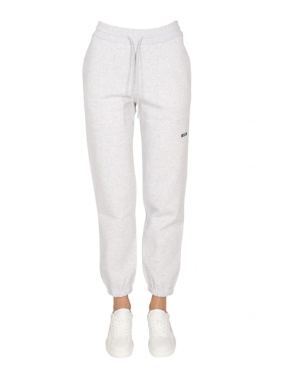 Shop Msgm Jogging Pants With Logo Print In Grey