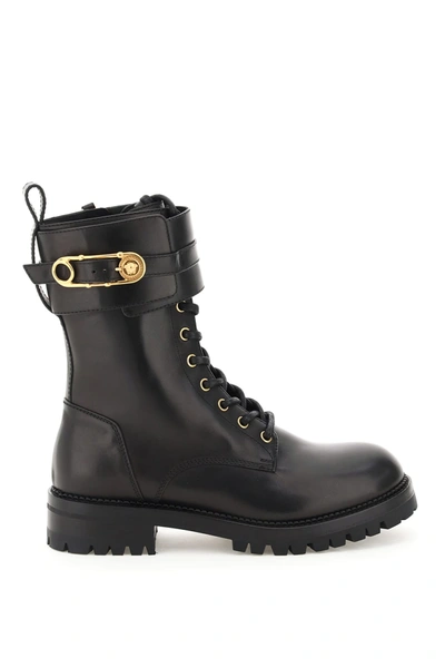 Shop Versace Combat Boots With Medusa Safety Pin In Black (black)