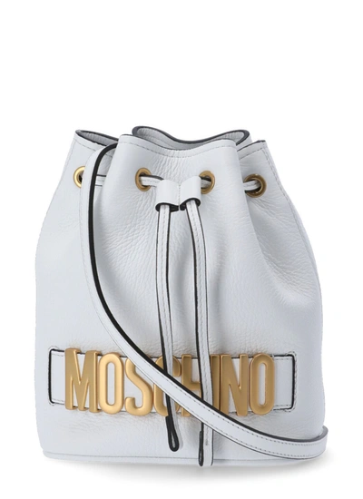 Shop Moschino Logo Plaque Drawstring Bucket Bag In White