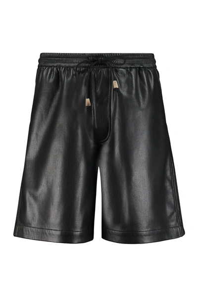 Shop Nanushka Faux Leather Shorts In Black