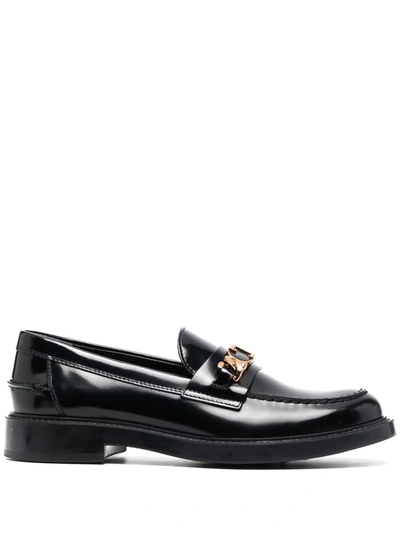 Shop Tod's Logo-plaque Leather Loafers In Schwarz