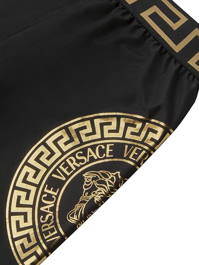 Shop Versace Little Boy's & Boy's Medusa-print Swim Shorts In Black