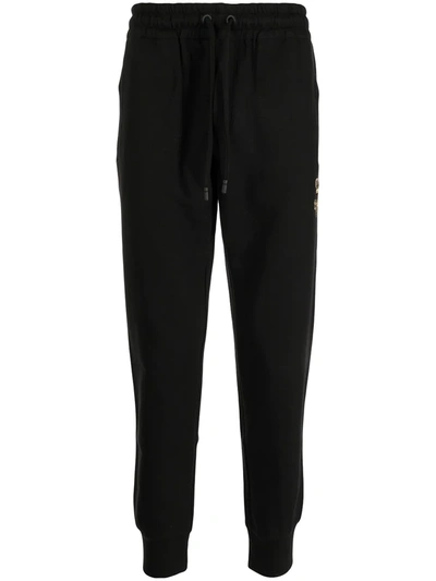 Shop Dolce & Gabbana Crest-embroidered Track Pants In Black
