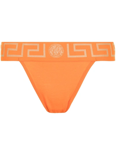 Shop Versace Greca Waistband Thong In Orange