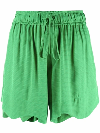 Shop Ganni Scalloped Hem Shorts In Green