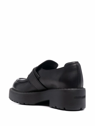 Shop Miu Miu Flat Shoes Black