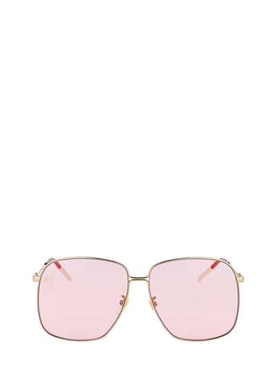 Shop Gucci Gg0394s Gold Sunglasses