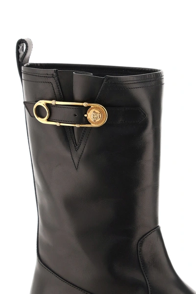 Shop Versace Biker Boots With Medusa Safety Pin In Black