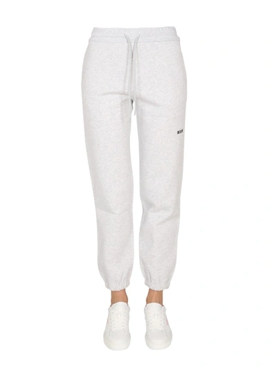 Shop Msgm Jogging Pants With Logo Print In Grey