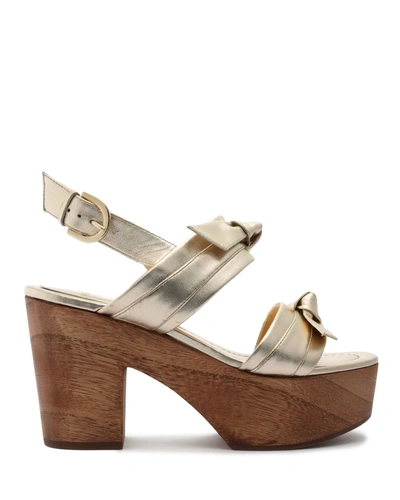 Shop Alexandre Birman Clarita Metallic Bow Clog Sandals In Golden