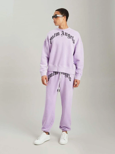 Shop Palm Angels Trousers Lilac