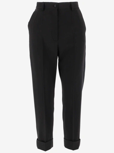 Shop Dolce & Gabbana Cuffed Hem Tapered Trousers In Black