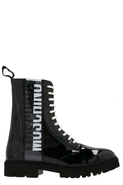 Shop Moschino Logo Printed Combat Boots In Black