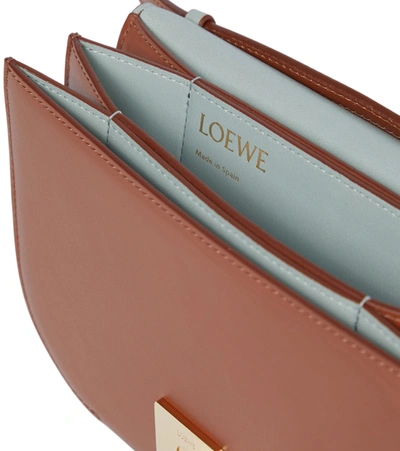 Shop Loewe Goya Leather Clutch In Brown