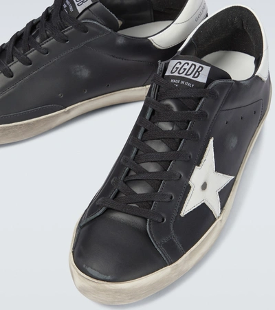 Shop Golden Goose Super-star Leather Sneakers In Black/white