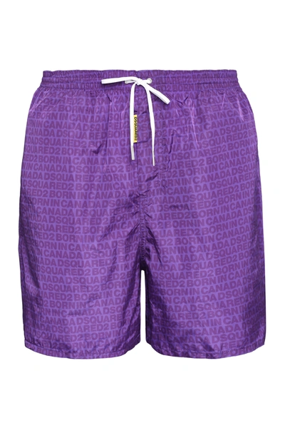 Shop Dsquared2 Allover Logo Printed Swim Shorts In Purple