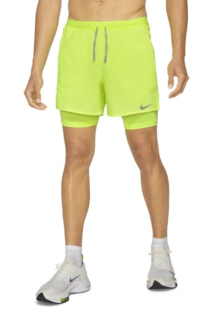 Shop Nike Dri-fit Flex Stride Pocket 2-in-1 Running Shorts In Volt/ Volt