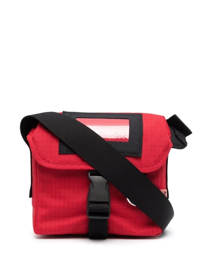 Shop Acne Studios Grid-pattern Buckled Messenger Bag In Red