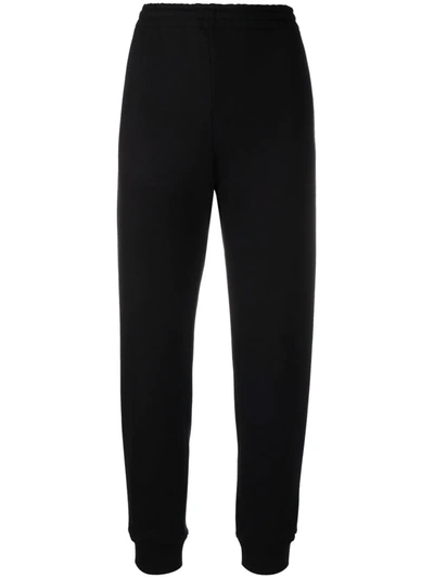 Shop Moschino High-waisted Cotton Track Pants In Schwarz