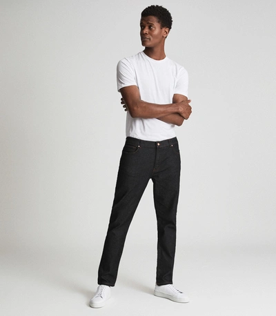 Shop Reiss Tapered Slim Fit Jersey Stretch Jeans In Indigo
