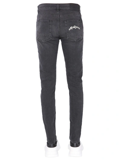 Shop Alexander Mcqueen Jeans With Embroidered Logo In Black