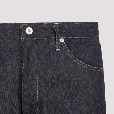 Shop Jil Sander Twisted Raw Denim Jeans In Blue