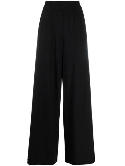 Shop Alice And Olivia Elasticated-waistband Flared Trousers In Schwarz