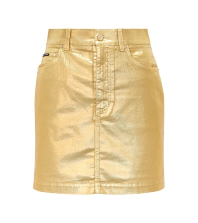 Shop Dolce & Gabbana Coated Denim Miniskirt In Gold