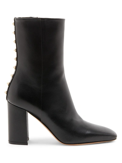 Shop Valentino Rockstud Leather Booties In Nero