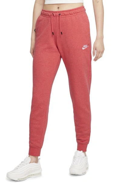 Shop Nike Sportswear Essential Fleece Pants In Magic Ember/ Heather/ White