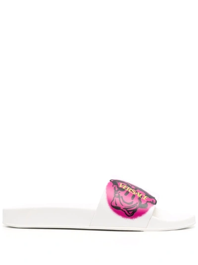 Shop Versace Graphic Logo-print Slides In White