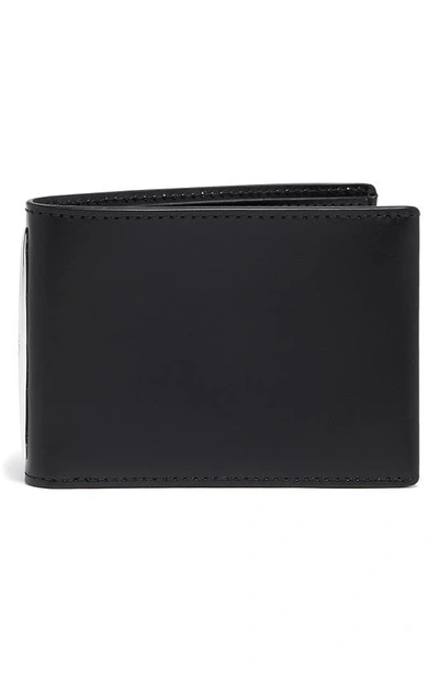 Shop Tumi Donnington Slim Leather Bifold Wallet In Black