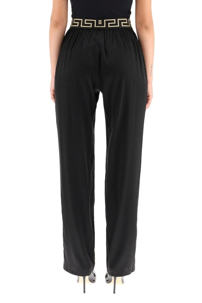 Shop Versace Silk Satin Pajama Trousers With Greca Band In Mixed Colours
