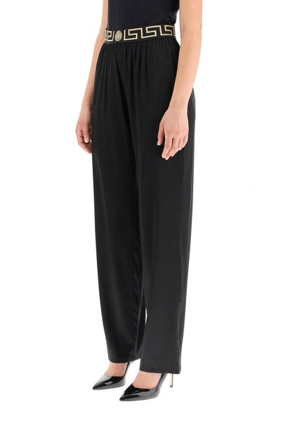 Shop Versace Silk Satin Pajama Trousers With Greca Band In Mixed Colours